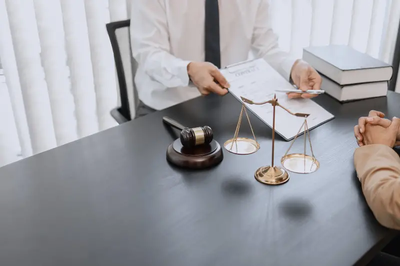 Lawyer and his client talking inside the office