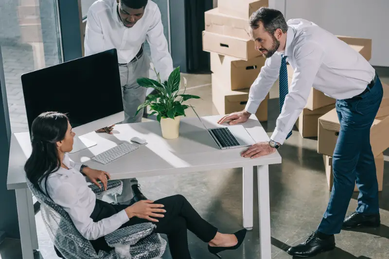 High angle view of multiethnic colleagues working in new office