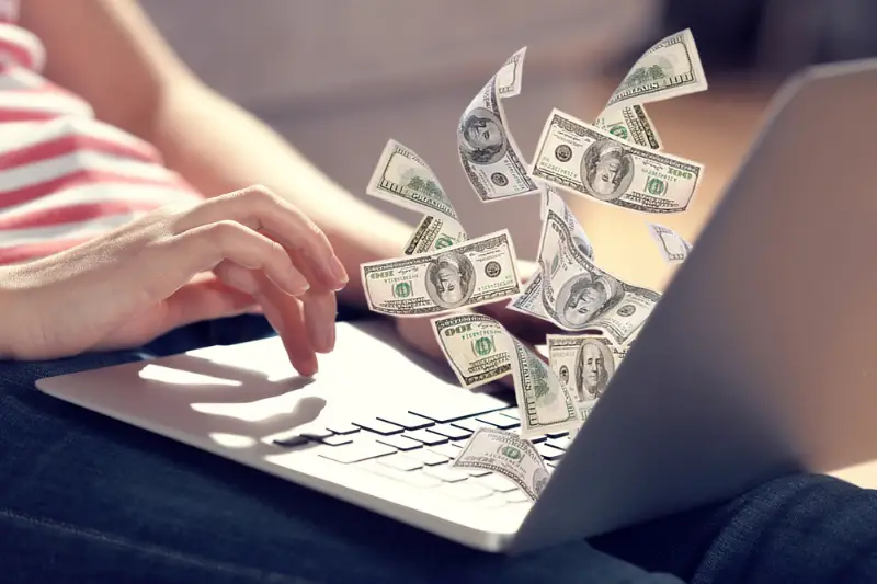 Woman sitting and working with a laptop