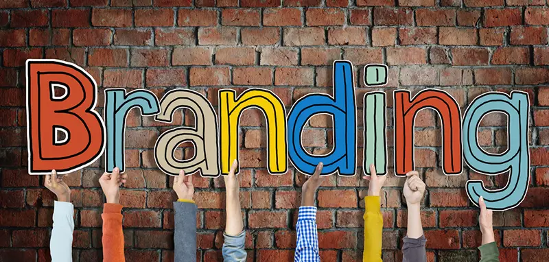 Hands holding word Branding