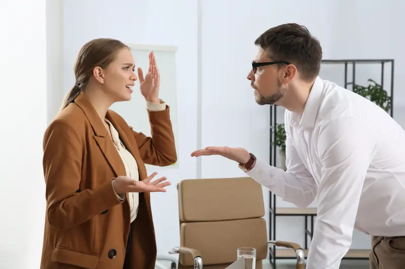 Emotional colleagues arguing in office