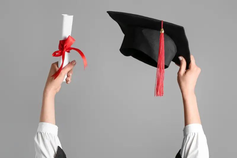 Woman with graduation hat and diploma