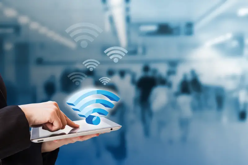 Businesswoman connecting to Wifi