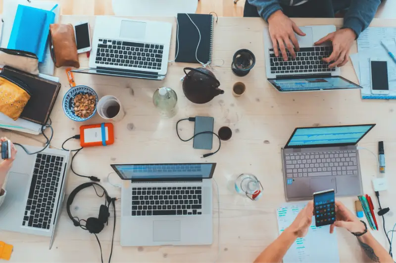 Office meeting table with laptop and office stuff