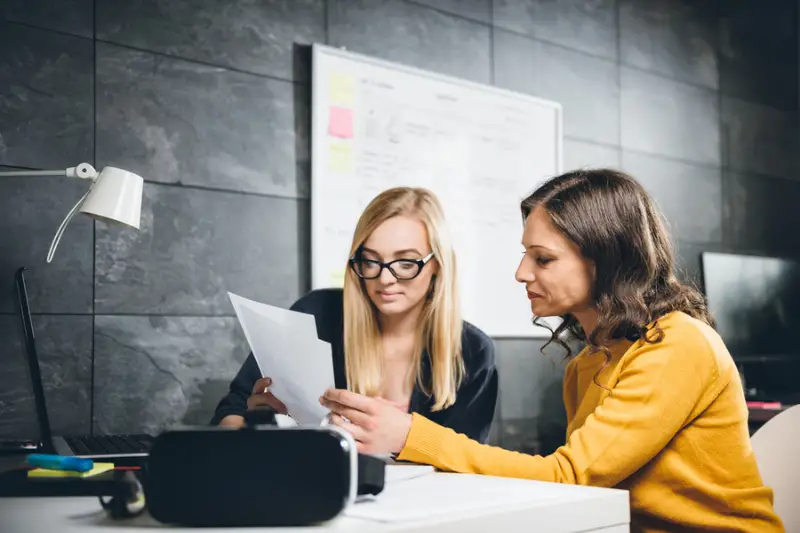 Two business women working at office