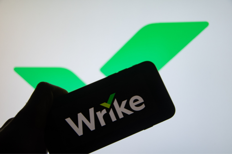 The "Wrike" brand logo on a smartphone display (focus on the brand logo)