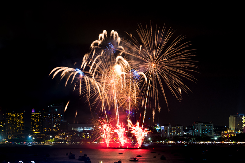 Firework blast in dark sky at night celebration new year count down