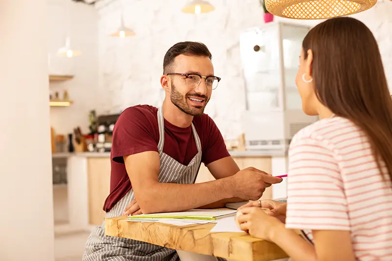 Couple developing family business talking to each other