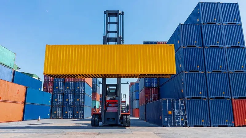 forklift working in the container cargo yard port loading cargo tank logistic service and transport