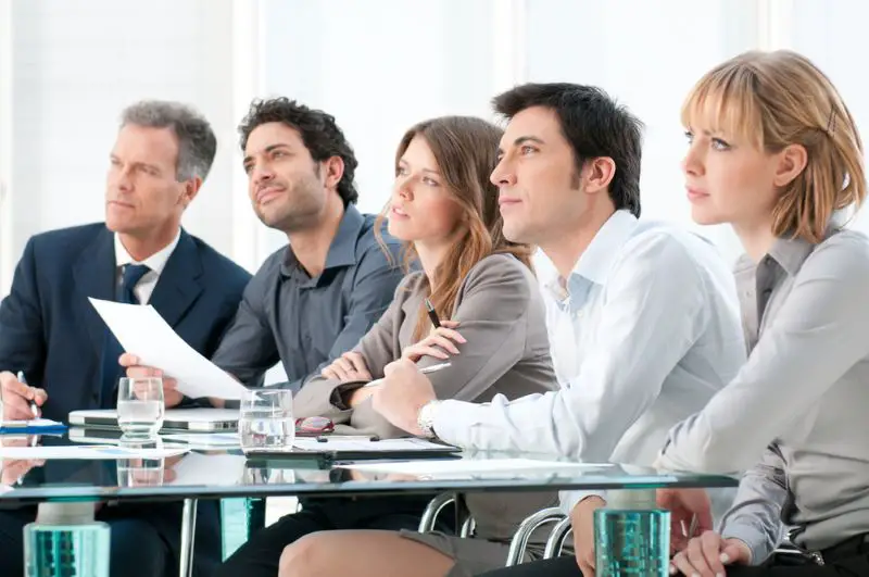 People actively listening to a Business presentation