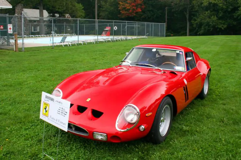 A closeup of a red 1962 Ferrari 250 GTO displayed