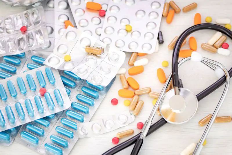 A large amount of medicine with a stethoscope on the doctor's desk