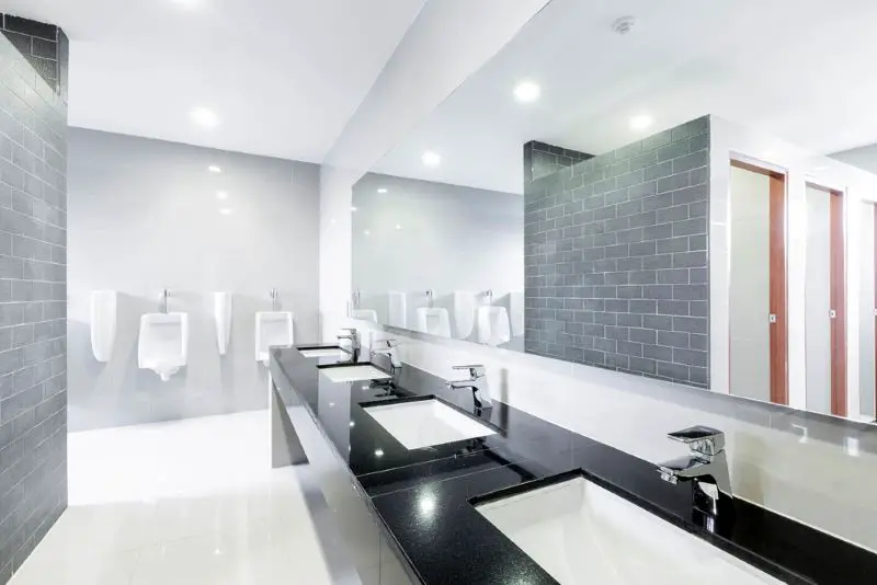 Public Interior of bathroom with sink basin faucet lined up mode