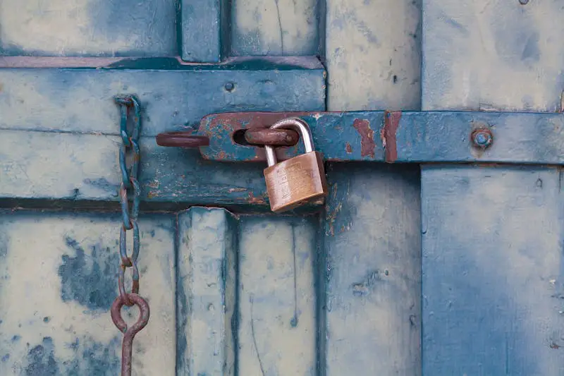 Blue wooden door with padlock