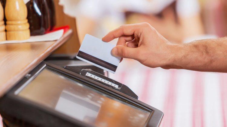 Close-up of cashier hands – at a POS system