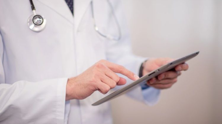 Doctor using digital tablet