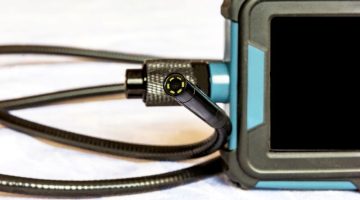 Endoscope camera on the table. Flexible visual inspection camera