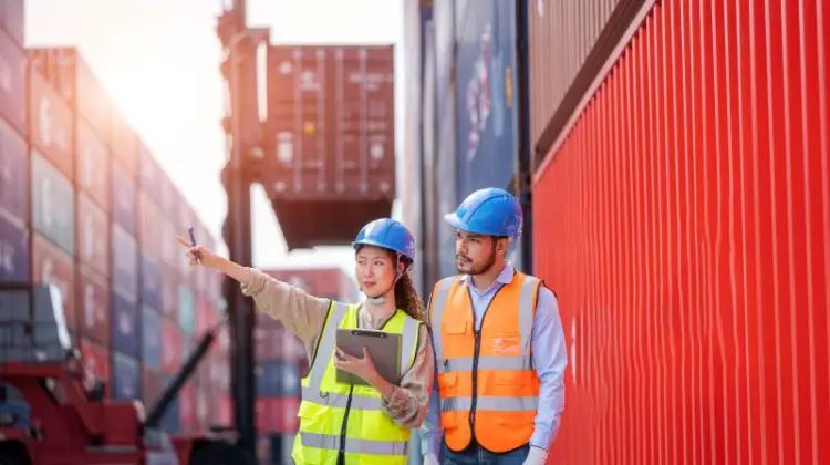 Foreman man and worker working checking at Container cargo,Logistics import export shipping concept.