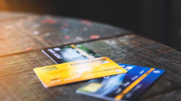 Several credit cards on wooden table