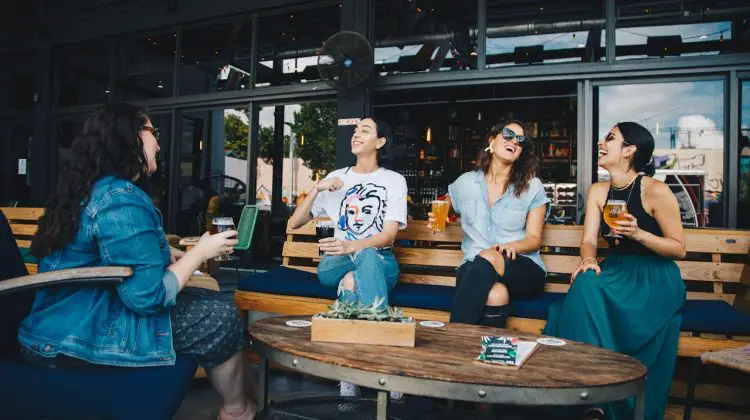 group of female friends networking - having a drink and a laugh