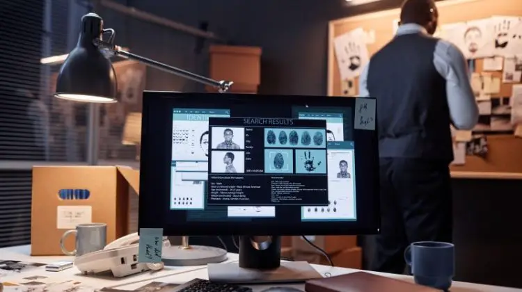 Computer with case file on screen in detectives office