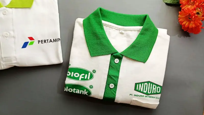 White and green company t-shirt with logo