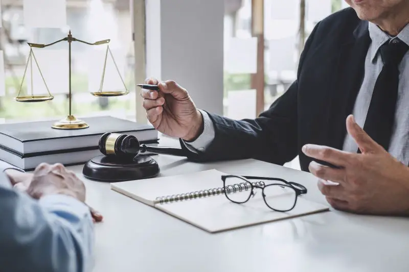 Consultation and conference of male lawyer and client in a discussion