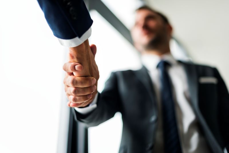Handshake business men concept